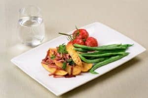 Wedges with bacon beans and tomatoes