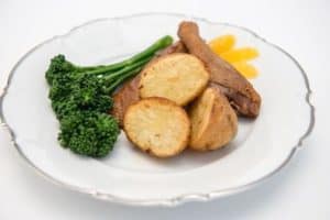 Roast potatoes with duck legs