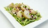 Boiled potatoes with onion and capsicum dressing