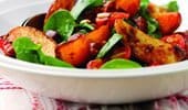 Potato wedges with chorizo and spinach salad