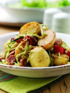 Warm potato salad with bacon and capsicum