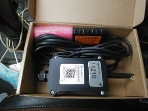 LoRaWAN soil moisture sensor device with cables in cardboard box