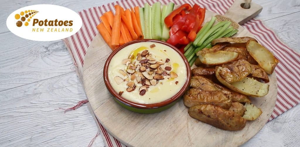 Roasted potatoes with vegetable sticks and creamy dip platter