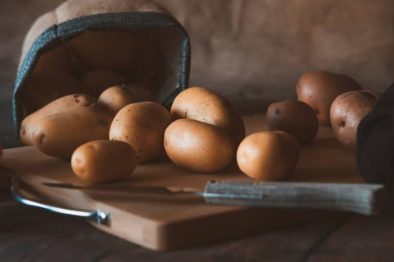 New potatoes harvested from an urban garden. Eco-sustainable,. Presented in the form of a still life. Natural light from a nearby window