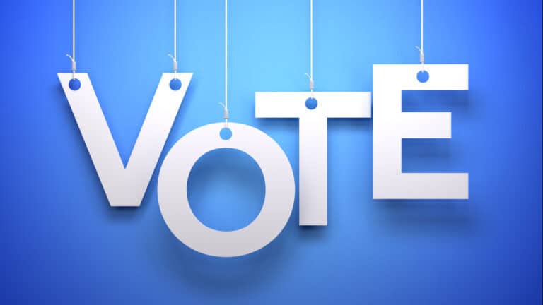 This 3D illustration serves as a powerful and modern call to action for civic engagement. The word "VOTE" is rendered in bold, white, tag-style letters, hanging against a clean blue background. This graphic is a direct and impactful symbol for elections, democracy, and political participation. The concept of the letters being 'hooked' can add a layer of meaning about voter engagement or political campaigns. It's an ideal visual for get-out-the-vote initiatives, political news, campaign materials, and educational content about the importance of voting.