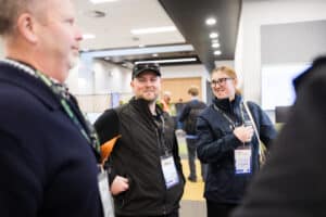 People networking and smiling at a professional conference event.