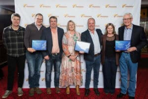 Group of people posing with award certificates at Potatoes New Zealand event