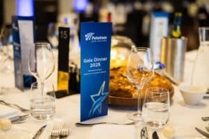 Elegant gala dinner table setup with New Zealand potatoes menu.