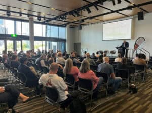 Audience attending a business presentation in conference room