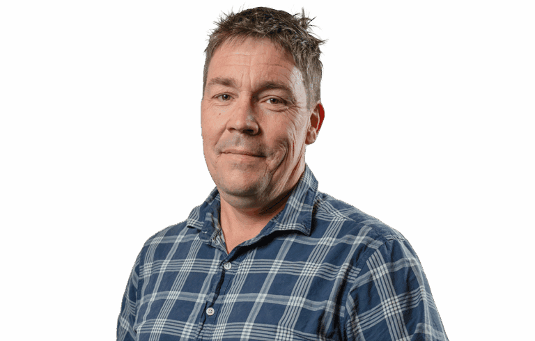 Middle-aged man with short hair wearing plaid shirt isolated