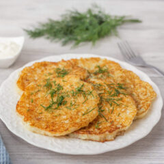 Potato pancakes with sour cream and dill.